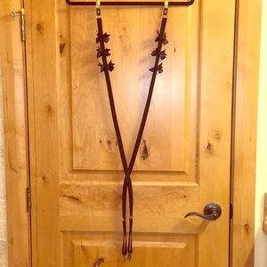 Black suspenders with black silk bows